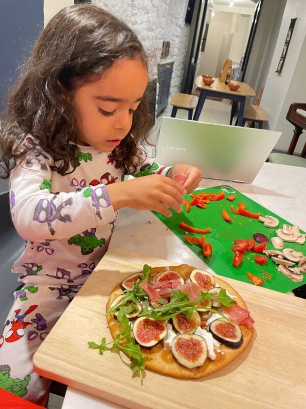 noah making a pizza