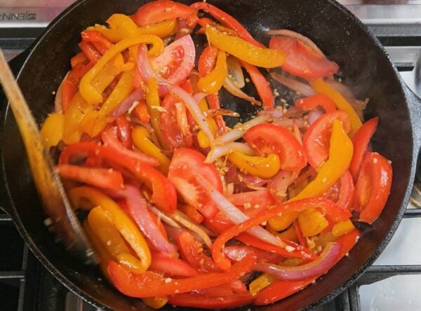 Tomatoes added to the stir fry.