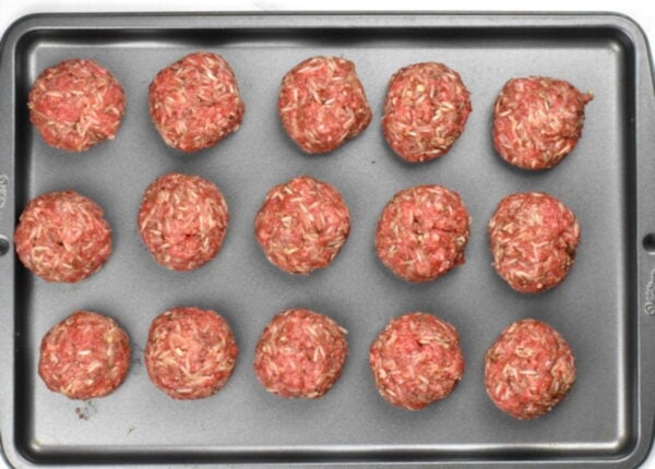 Formed meatballs on a tray.
