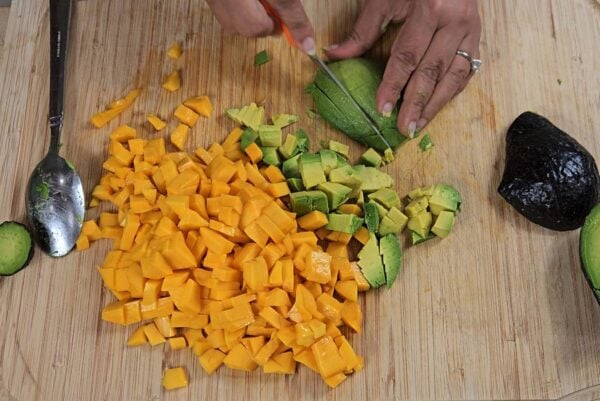 Chopping mango and avocado.
