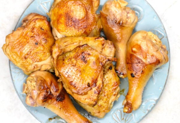 Seared chicken pieces on a plate.