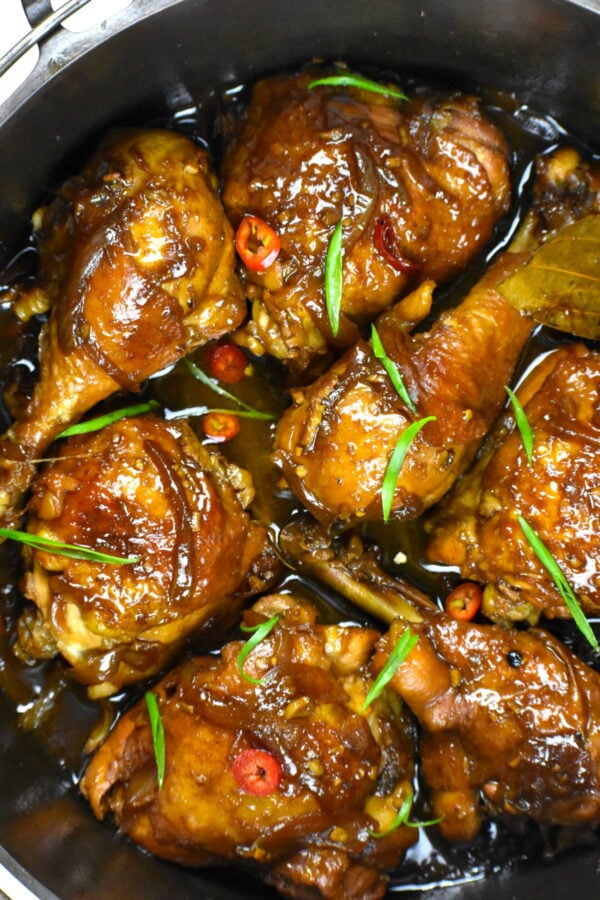 Filipino chicken adobo in a cast iron pot.