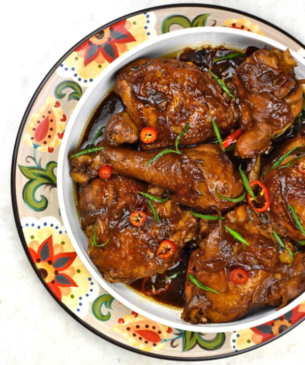 Bowl of chicken adobo atop the Gypsy Plate.
