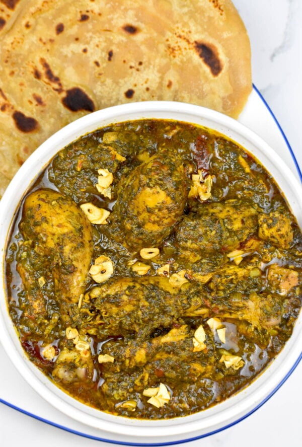 Serving murg saagwala with roti.