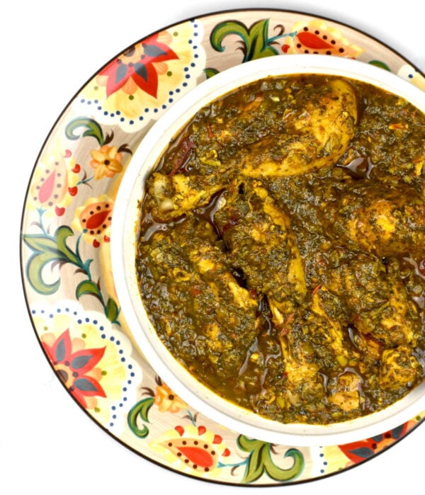 Serving of chicken saagwala atop the Gypsy Plate.