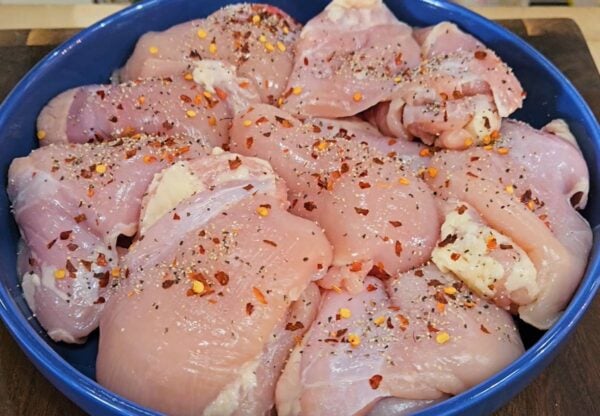 Seasoned chicken prior to cooking.