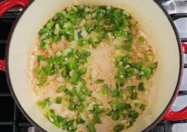 Cooking the onion and pepper with garlic.