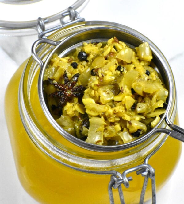 straining the mixture into a jar.