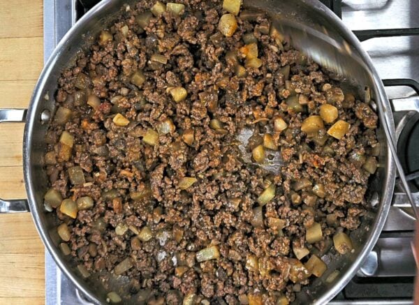 Ground beef and vegetable mixture with tomato paste and flour mixed in.