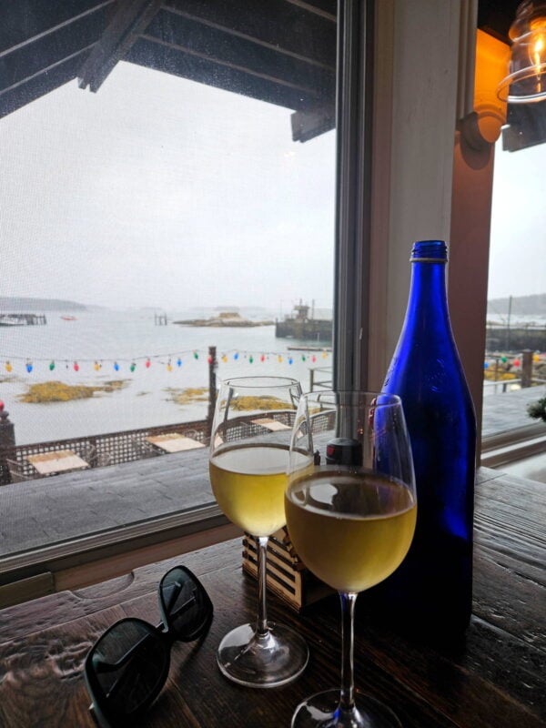 Two glasses of wine at a seaside seafood restaurant