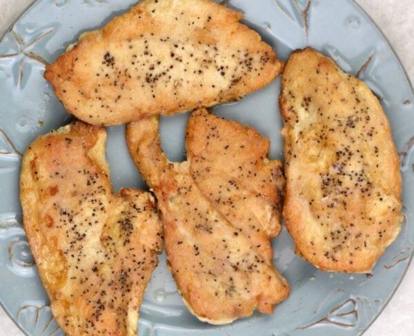Searing the chicken cutlets.