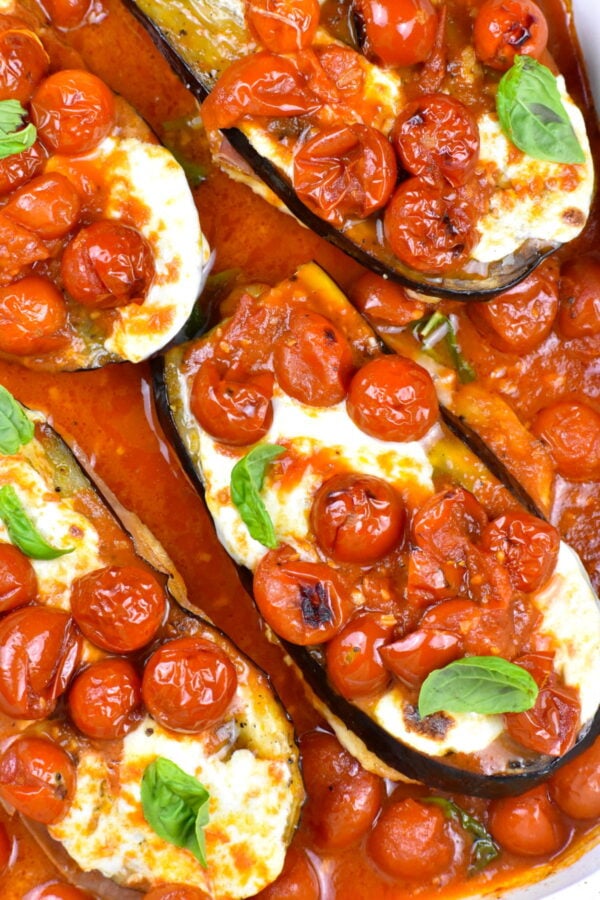 Baking dish full of chicken and eggplant sorrentino.
