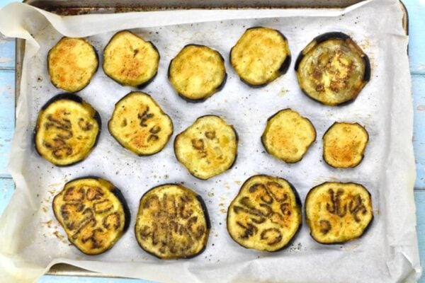 Roasted eggplant on a baking sheet.