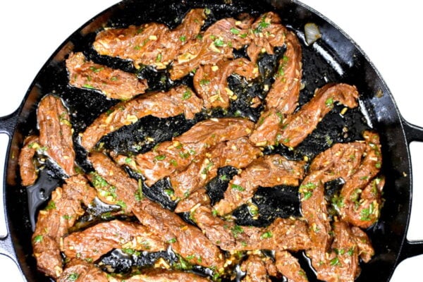 searing the steak strips.