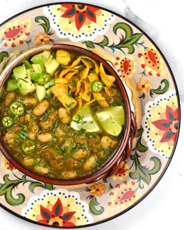 Bowl of green chicken chili atop the Gypsy Plate.