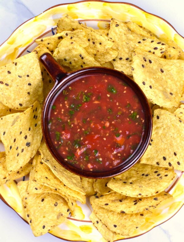Bowl of salsa served with chips.