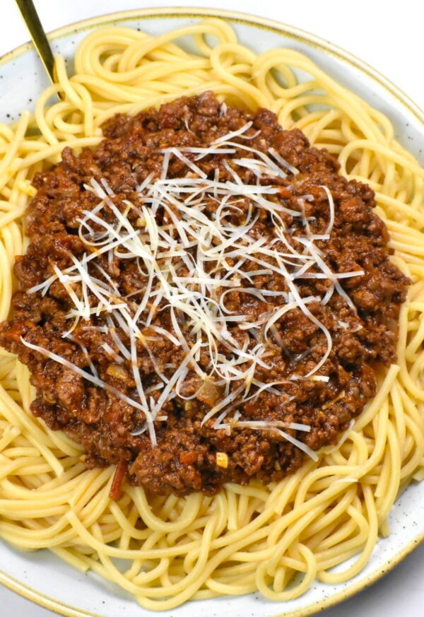 Meat sauce ladled over the pasta.