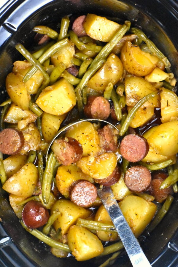 Swamp potatoes, a slow cooker dish of potatoes, green beans, onion and sausage, along with plenty of seasoning.
