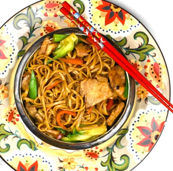 bowl of chicken lo mein atop the gypsy plate