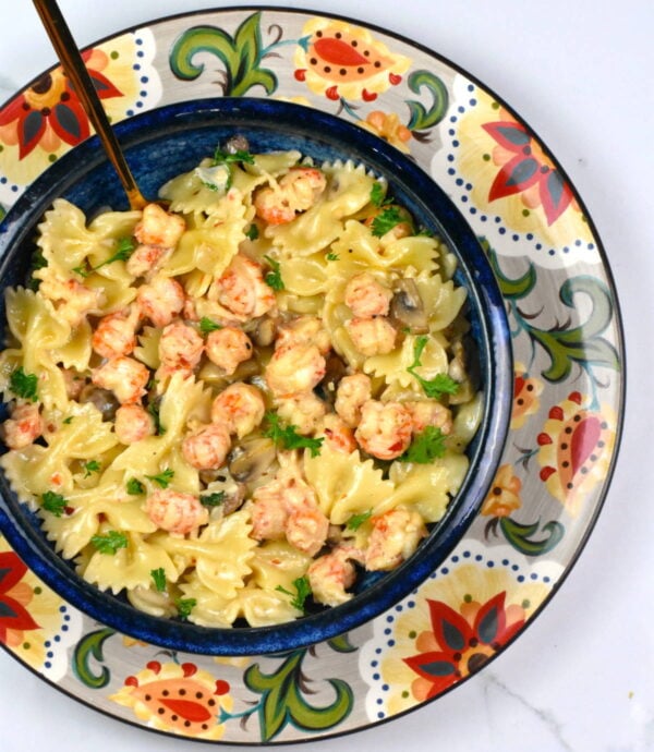 bowl of langostino pasta atop the Gypsy Plate