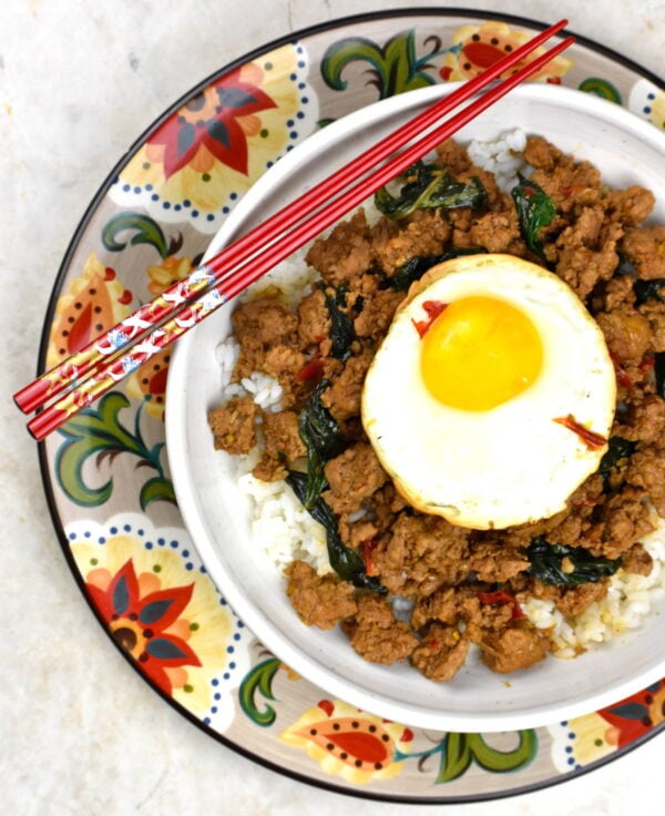 bowl of thai basil pork atop the gypsy plate