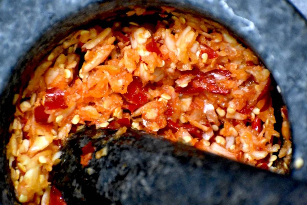 mashing up the garlic and chilis