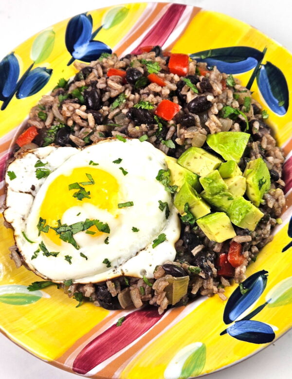 gallo pinto with a runny egg