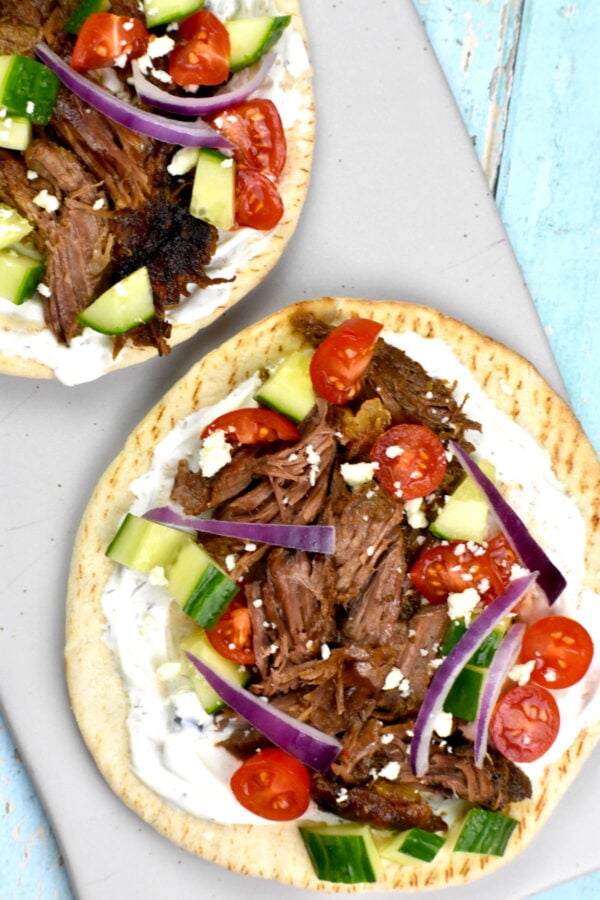 cutting board with two lamb gyros