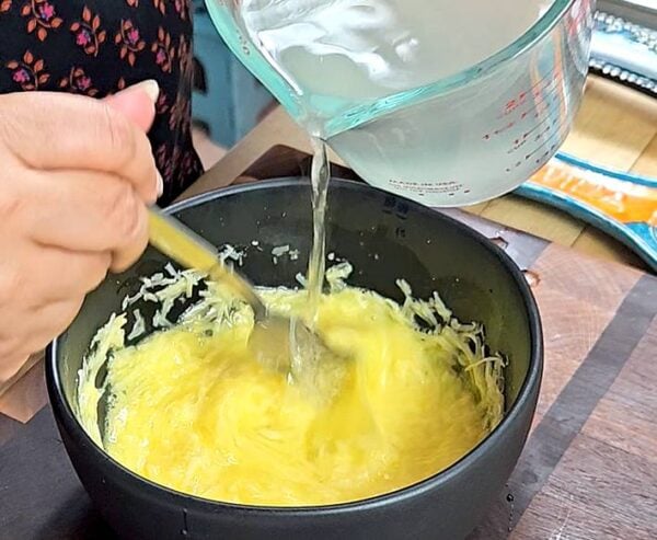 stirring pasta water into the eggs