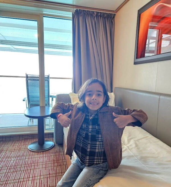 Noah giving a thumbs up in the cabin