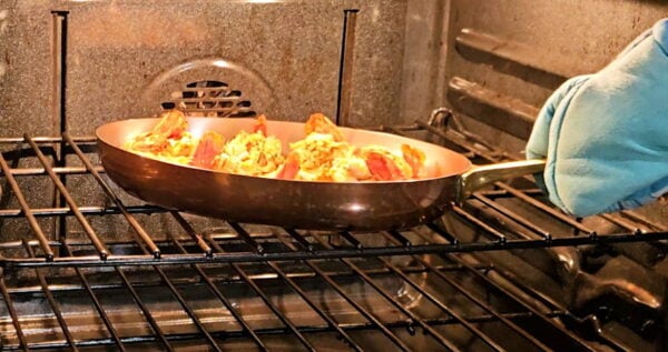placing shrimp in oven.