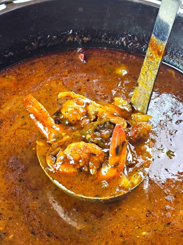 ladling out a scoop of gumbo