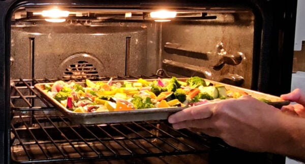 placing the sheet pan in the oven