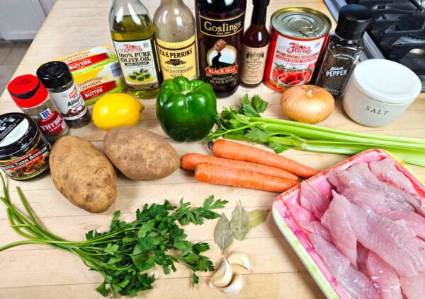 Bermuda fish chowder ingredients arranged on a counter.