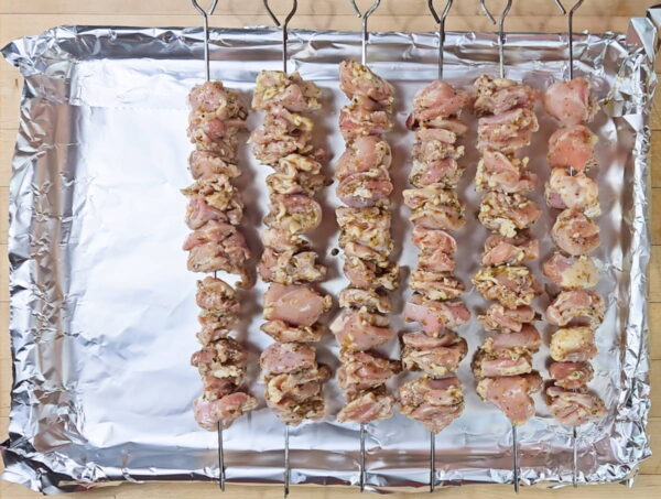 skewering the chicken