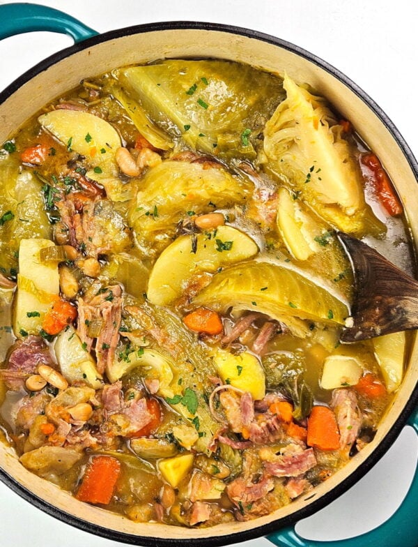 Garbure in a large blue Dutch oven.