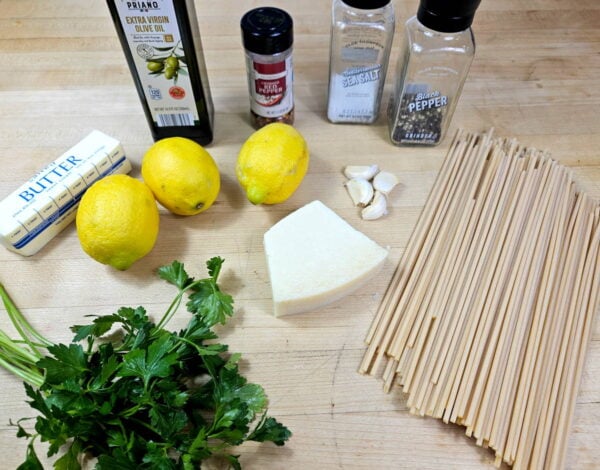 Ingredients for lemon pasta recipe arranged on a counter.