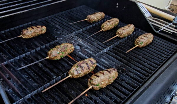 Grilling the kofta kebabs.