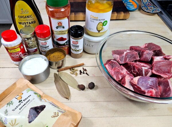 Rogan josh ingredients arranged on a counter.
