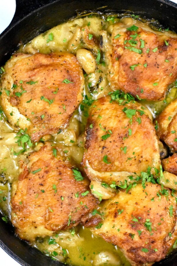 40 clove garlic chicken in a cast iron skillet.