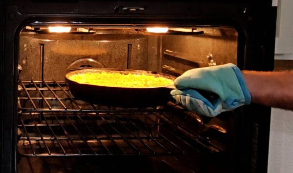 Sticking the casserole in the oven.