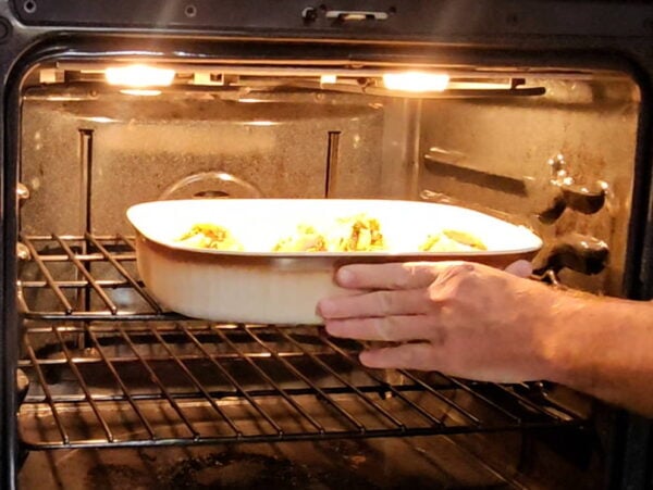 Placing the crabs in the oven.