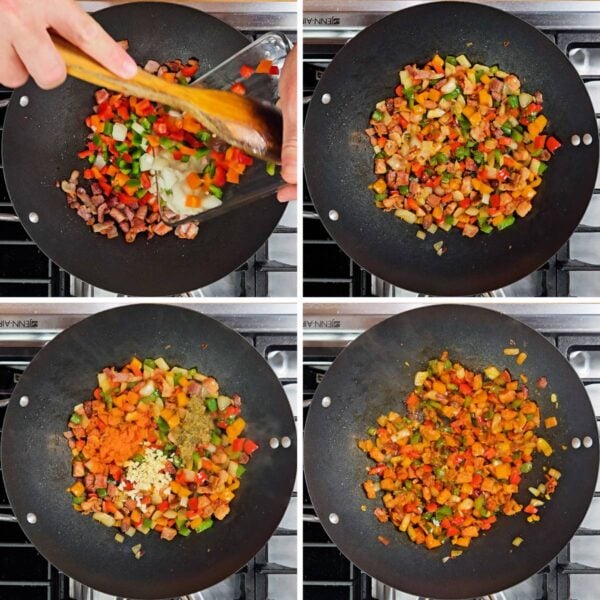 Adding diced vegetables, sazon, garlic and sofrito to the skillet.