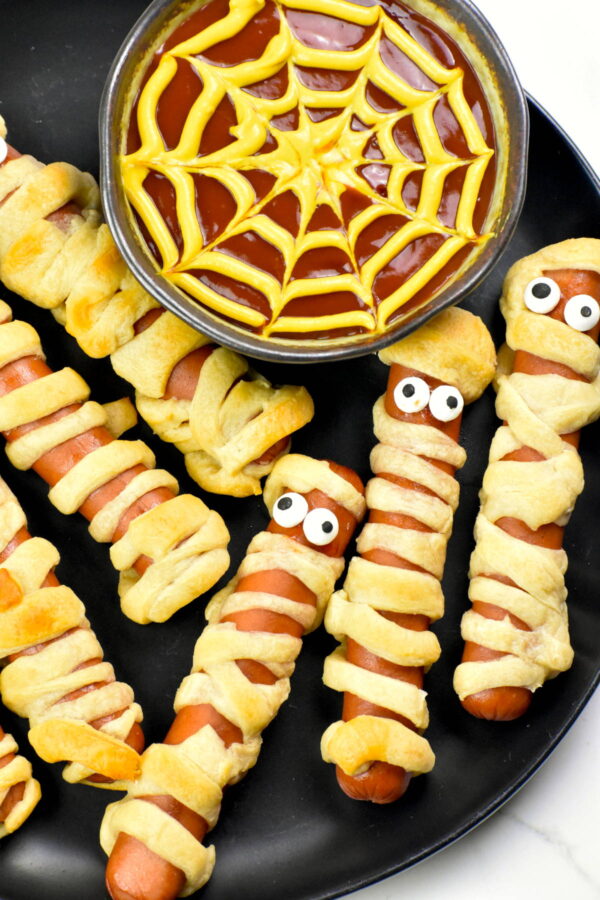 Plate of hot dogs wrapped in crescent dough.