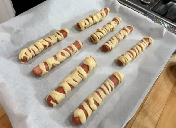 Wrapped hot dogs, before baking.